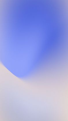 an abstract blue and white background with some blurry lines in the bottom right corner