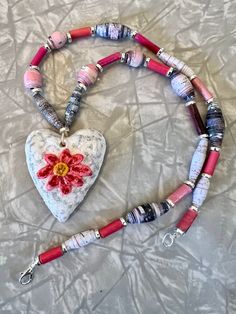 Hand-rolled and glossed paper bead necklace with paper clay heart pendant decorated with sealed-in glitter. Silver toned accents. White Heart-shaped Polymer Clay Jewelry, Paper Bead Necklace, Grey Paper, Paper Beads Necklace, Clay Heart, Reno Nv, Paper Clay, Paper Beads, Wedding Jewellery Necklace