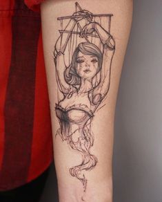 a woman's leg with a tattoo on it