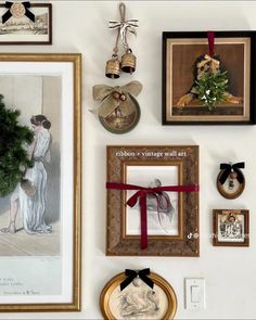 there are many framed pictures on the wall with christmas decorations and ornaments hanging above them