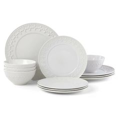 a white dinner set with black trimmings