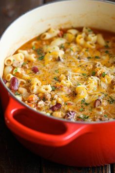 one pot chili macaroni and cheese in a red casserole dish on a wooden table