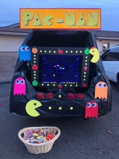 an arcade machine decorated to look like pacman