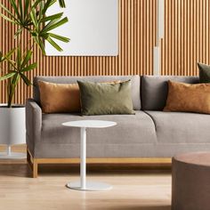 a living room scene with focus on the couch and coffee table in the foreground