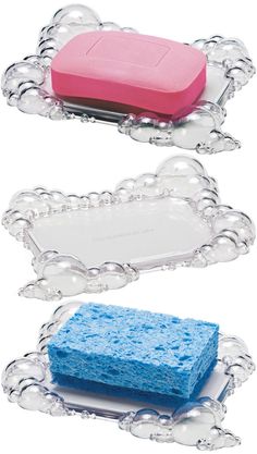 two pieces of soap sitting on top of each other in front of a white background