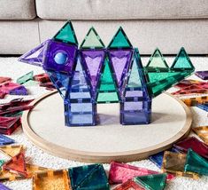 colorful glass pieces sitting on top of a rug