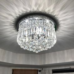 a chandelier hanging from the ceiling in a room