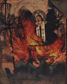 an image of the virgin mary on fire in front of a gate with flames coming from it