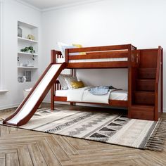 a bunk bed with a slide in the middle