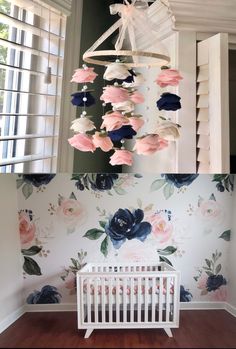 a baby's room with floral wallpaper and white crib