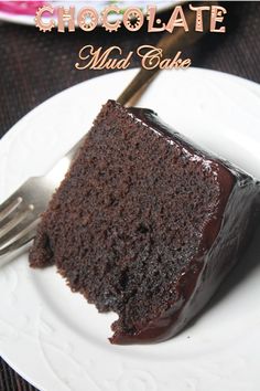 a piece of chocolate mud cake on a white plate