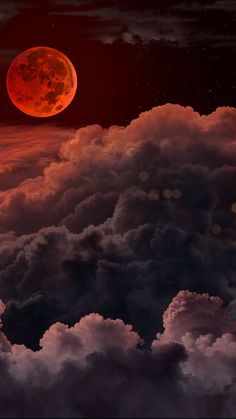 the red moon is shining in the sky above some clouds and dark blue skies with white fluffy clouds