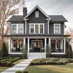 a gray house with white trim and black shutters