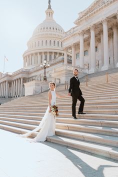 a bride and groom standing on steps in front of the capital building