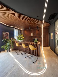 the interior of a modern office with wood paneling and neon lights on the walls