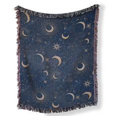 a blue tapestry with stars and crescents on it, hanging from the wall in front of a white background