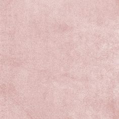 a light pink colored background with some stains