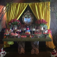 a table covered in lots of cake and cupcakes