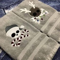 two towels with skull and crossbones on them are sitting on the floor next to each other