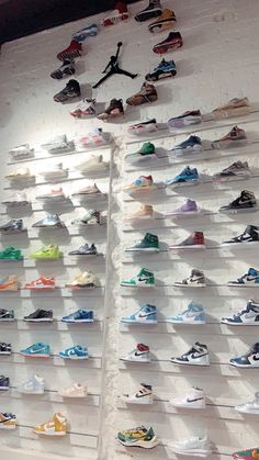 there are many pairs of shoes on display