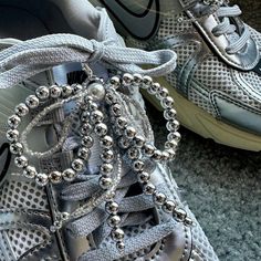 ✨Decorate your Shoes with Handmade Shoes Charms🤍 🪩Silver and Seed Beads Tassels Shoelace Charms ୨୧  ⋅  100% Handmade Y2K bowknot𐙚ྀིUnique gift ideas𐙚ྀི౨ৎ 𐙚   Charms may attach anyway/anywhere upon your desire👟 Start create you own personal style Today! Be Bow 🎀 Be Creative Product Detail: ❣️  Color : Silver🪩 and Ivory🤍 ❣️  Quantity : 1 pair [2pcs] ❣️  Material : Sliver Plastic Beads, Glass Beads, Faux Pearl Plastic Bead, Metal(Clasp), Fishing line ❣️  Estimated size : 3.5in * 3.25in    Each Charm has 1 Clasp   Sneakers Jewelry / Multipurpose Accessories   Can be hook on anywhere you want   100% Designed and Handmade in California Notice: ✔️ Selling 1 pair [2 pcs] Shoes Tassel Charms ONLY  ✔️ **Others items are NOT Included** ✔️ Item's color may slightly vary from the pictures due Silver Lace-up Party Sneakers, Silver Sporty Sneakers For Party, Shoelace Charms, Beads Tassels, Shoes Charms, Tassel Shoes, Sneaker Jewelry, Shoe Insoles, Unique Gift Ideas