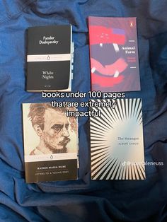 three books under 100 pages that are extremely impaciutily arranged on a bed