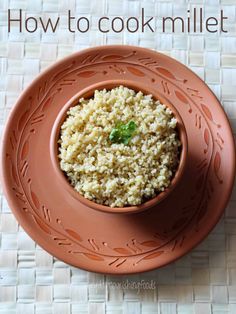 a brown bowl filled with rice on top of a table