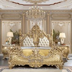 an ornately decorated bedroom with gold furniture and chandelier