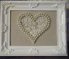 a white frame with buttons in the shape of a heart