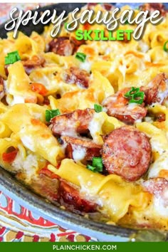 a close up of a pizza with sausage and pasta on it in a pan text reads spicy sausage skillet