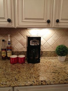 a coffee maker sitting on top of a kitchen counter