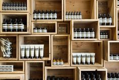 the shelves are filled with many different types of bottles and containers, all lined up against each other