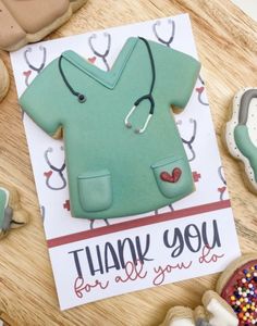 a thank you card with an image of a doctor's coat and stethoscope