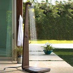 an outdoor shower is shown on the patio