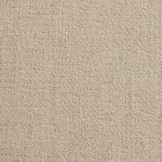 a close up view of a beige carpet