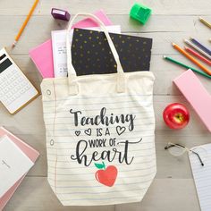 a teacher's tote bag sitting on top of a table