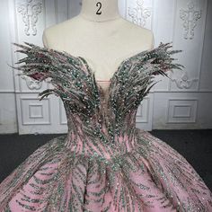 a pink ball gown with green and silver sequins