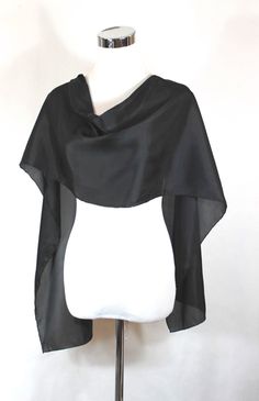 "Black silk shawl, Solid Black formal scarf, 14\"x72\" scarf, Solid black silk scarf, ready to ship, habotai silk scarf, black silk scarf. Product information: Designer - Mary Jane Davidson Material- 100 % natural 8mm Habotai silk Color - Solid Black Size - 14\"x72\" slight shrinkage may occur from steaming Package - Envelope or gift package Each scarf is unique and it is a true piece of wearable art, no one else is going to have the same scarf like you! Each scarf is painted by me one at a time Black Silk Scarf For Party, Elegant Black Shawl Scarves, Formal Black Shawl Scarves, Elegant Black Silk Scarf For Party, Elegant Black Silk Party Scarf, Classic Silk Scarves For Evening, Classic Silk Evening Scarf, Elegant Black Silk Scarf For Evening, Elegant Black Evening Shawl