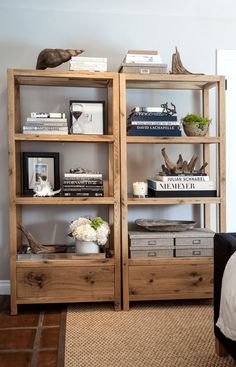 the bookshelf is made out of wooden crates