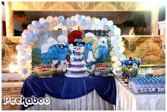 an image of a birthday party with cake and balloons