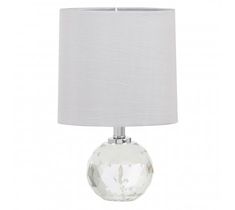 a clear glass table lamp with a white shade on the bottom and a silver base