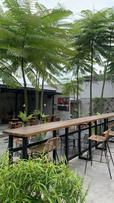 an outdoor seating area with tables and chairs