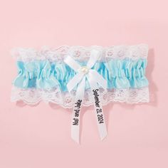 Searching for a meaningful gift for a bride-to-be or celebrating an anniversary? Our Personalized Sash Lace Garter is a heartfelt gesture that combines beauty and sentiment. It's a token of love that the recipient will treasure for years to come. Customized - Make your garter uniquely yours by adding your name and wedding date. Our personalized touch ensures that this garter holds a special place in your heart and becomes a cherished memory of your wedding day. Something Blue Tradition - Em... Wedding Gift For The Bride, Personalized Sash, Bride Garter, Gift For The Bride, Pearl Lace, Pearl Details, Purple Bows, Lace Garter, Pearl And Lace