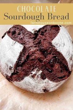 chocolate sourdough bread on parchment paper with text overlay