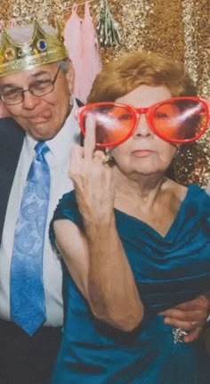 a man and woman posing for a photo booth