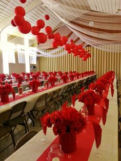 a banquet hall with red and white decorations