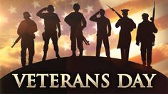 veterans day with silhouettes of soldiers and an american flag