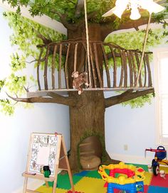 a child's bedroom with a tree house bed and play area in the corner