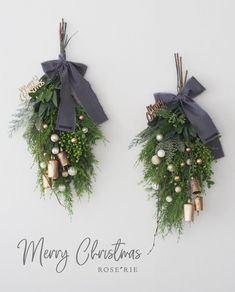 two christmas wreaths with bells and greenery