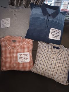 four different colored shirts are on display in front of a window with the same price tag